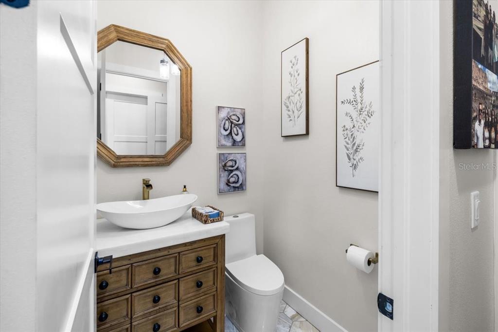 3344 Gulfview Drive Hernando Beach, FL 34607 - Photo 37 of 70 a bathroom with a toilet a sink and mirror