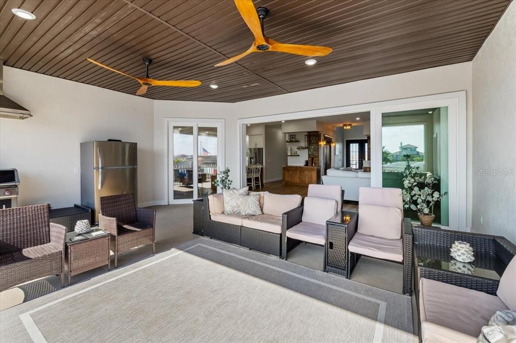 3344 Gulfview Drive Hernando Beach, FL 34607 - Photo 43 of 70 a outdoor living space with furniture potted plant and a large window