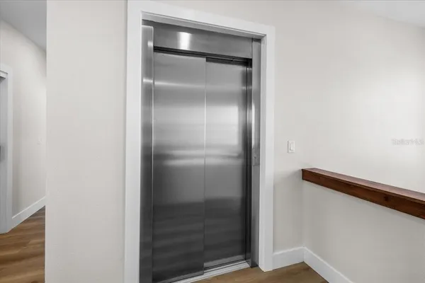 a view of swimming pool with seating space