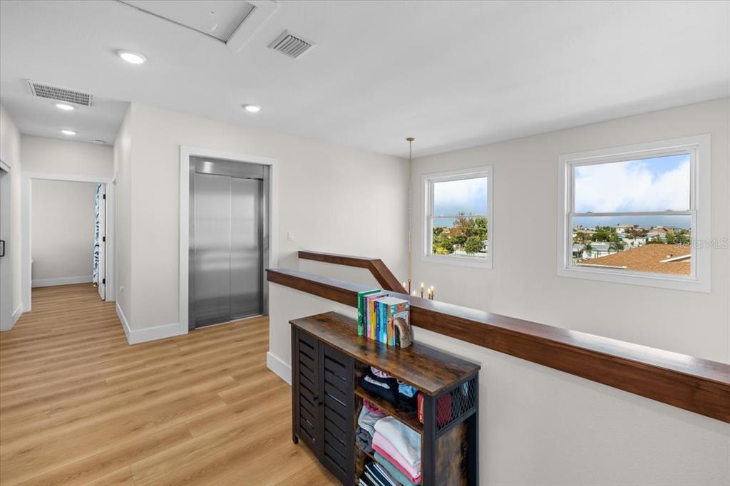 3344 Gulfview Drive Hernando Beach, FL 34607 - Photo 48 of 70 a view of hallway with wooden floor and stairs