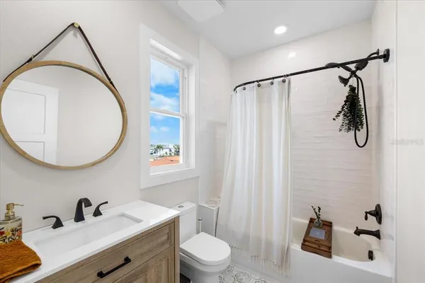 an aerial view of a house with a lake view