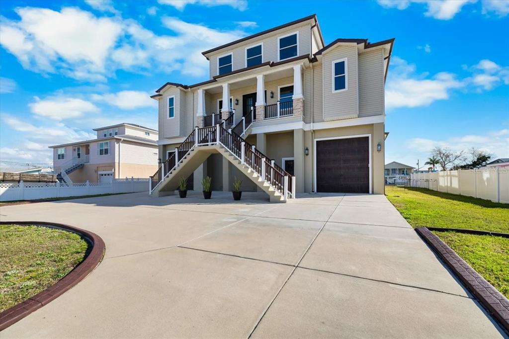 3344 Gulfview Drive Hernando Beach, FL 34607 - Photo 5 of 70 a front view of a house with garden