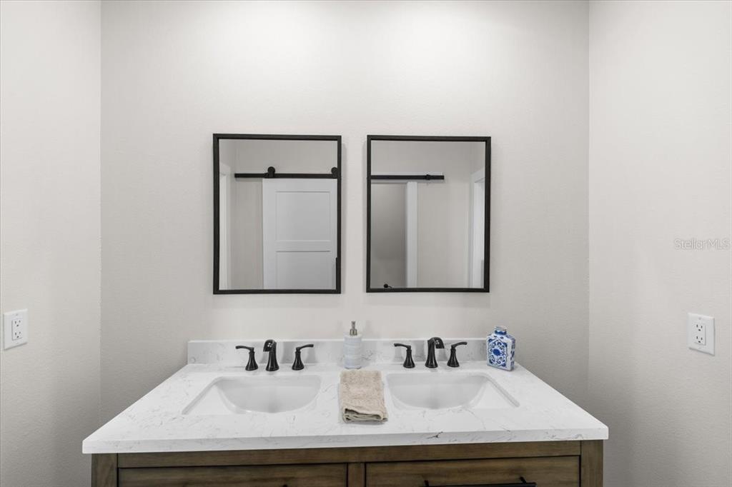 3344 Gulfview Drive Hernando Beach, FL 34607 - Photo 55 of 70 a bathroom with a sink and a mirror