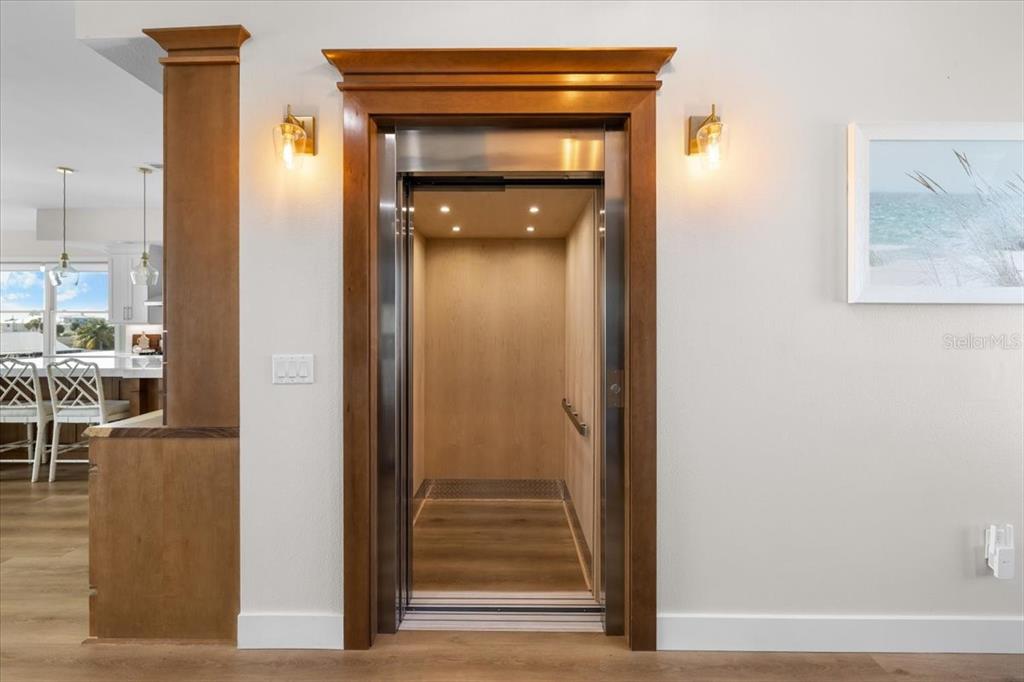 3344 Gulfview Drive Hernando Beach, FL 34607 - Photo 58 of 70 a view of a hallway with wooden floor and windows
