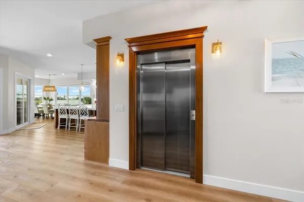 a view of an entryway with wooden floor