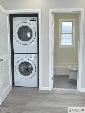 a view of a hallway with washer and dryer