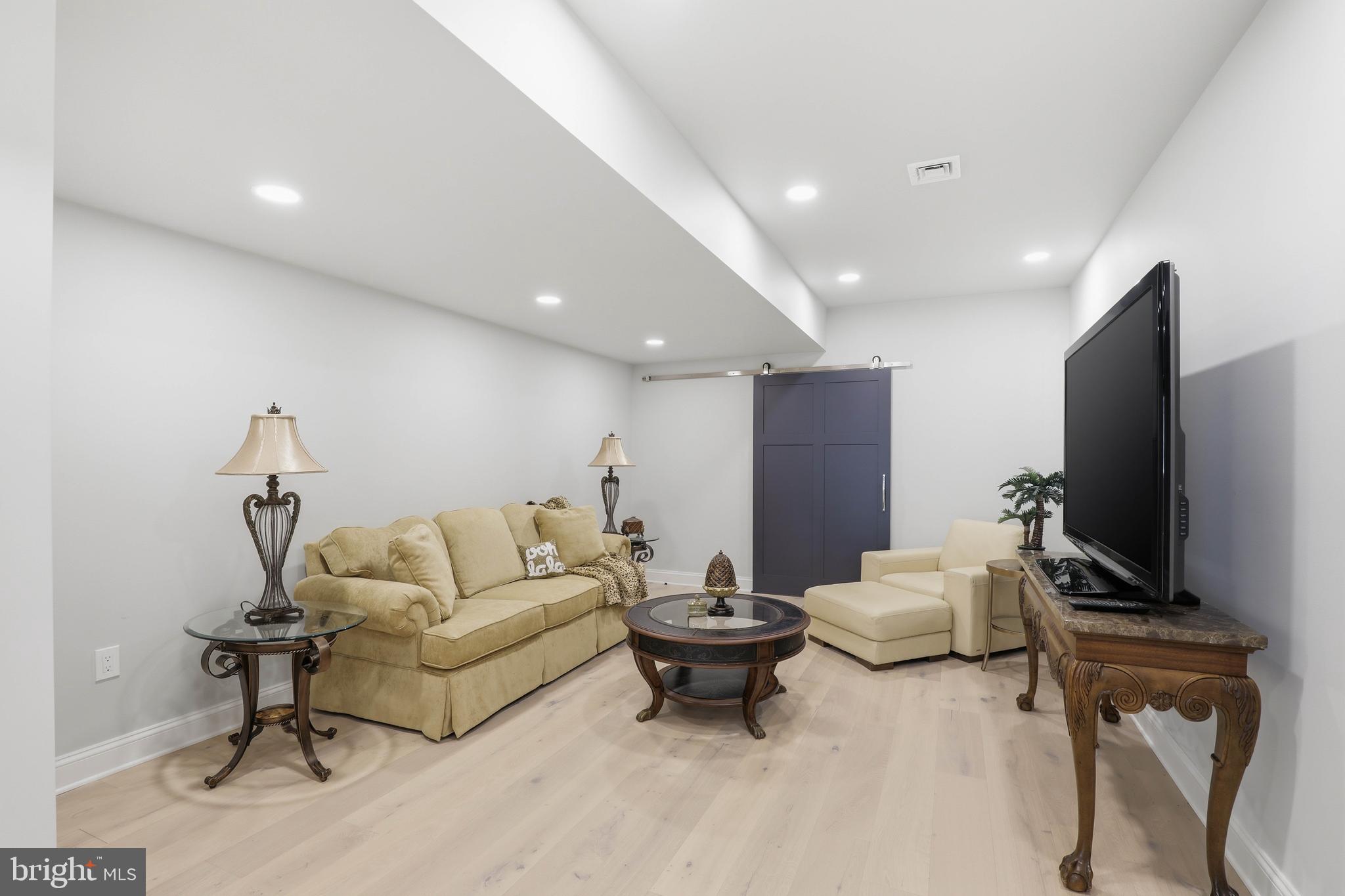 360 Addison Place Lancaster, PA 17601 - Photo 62 of 78 a living room with furniture and a flat screen tv