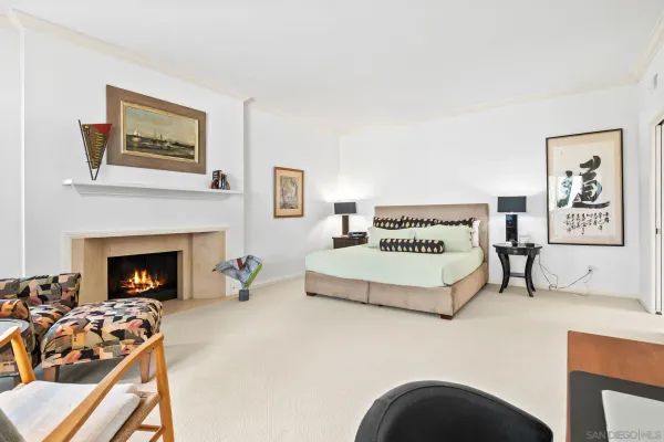 a bathroom with a granite countertop sink mirror vanity and toilet