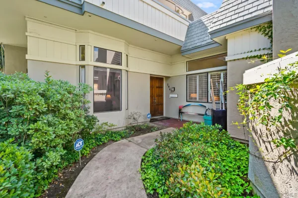 a front view of a house with garden
