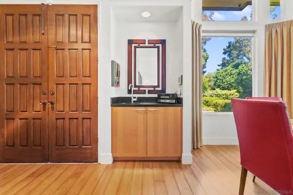 a kitchen with stainless steel appliances granite countertop a stove and a large window