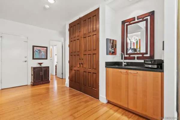 a kitchen with stainless steel appliances kitchen island granite countertop a sink and cabinets
