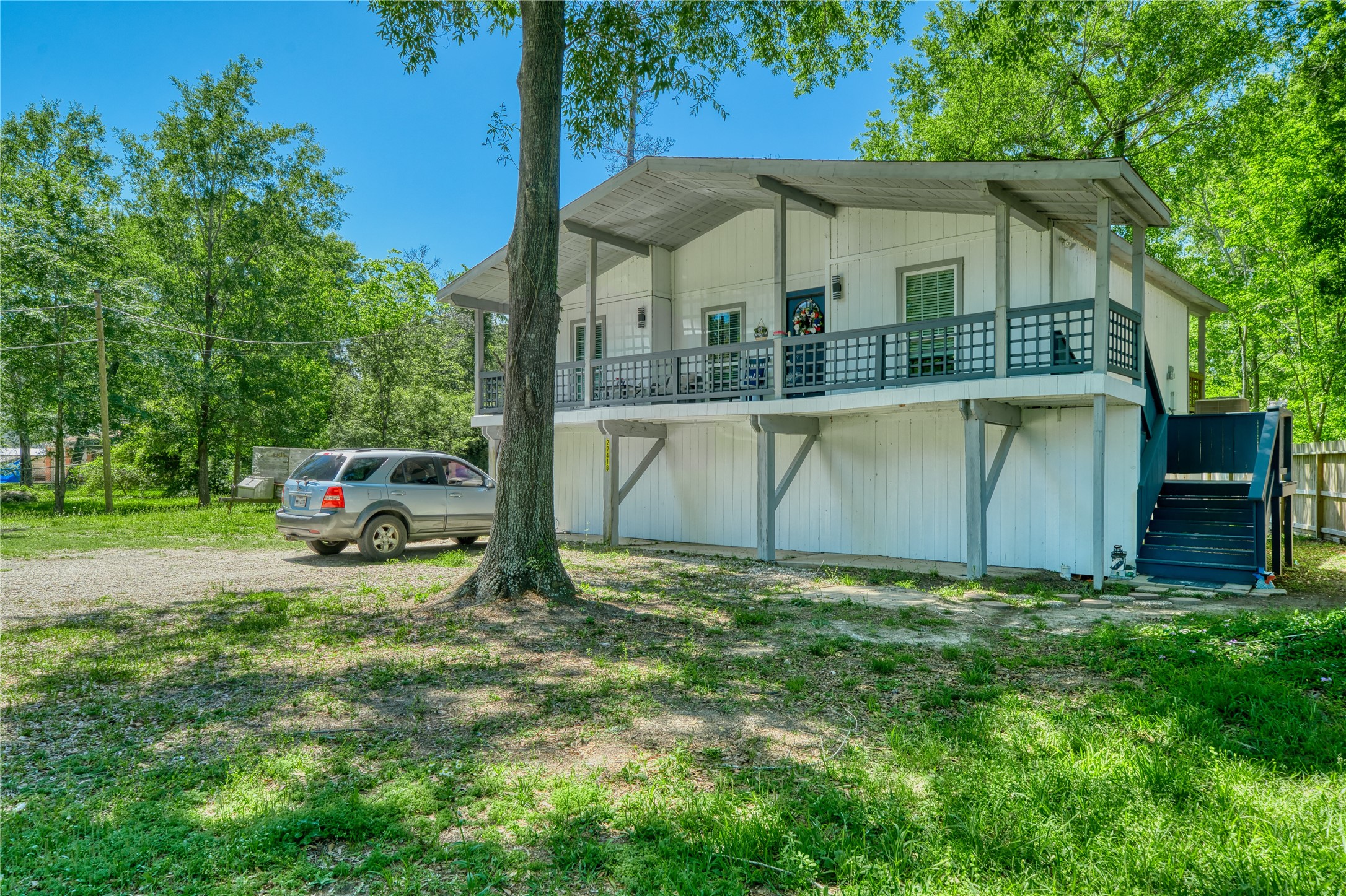 22418 East Shorewood Loop Houston, TX 77336 - Photo 1 of 20 a view of a house with a yard and sitting area