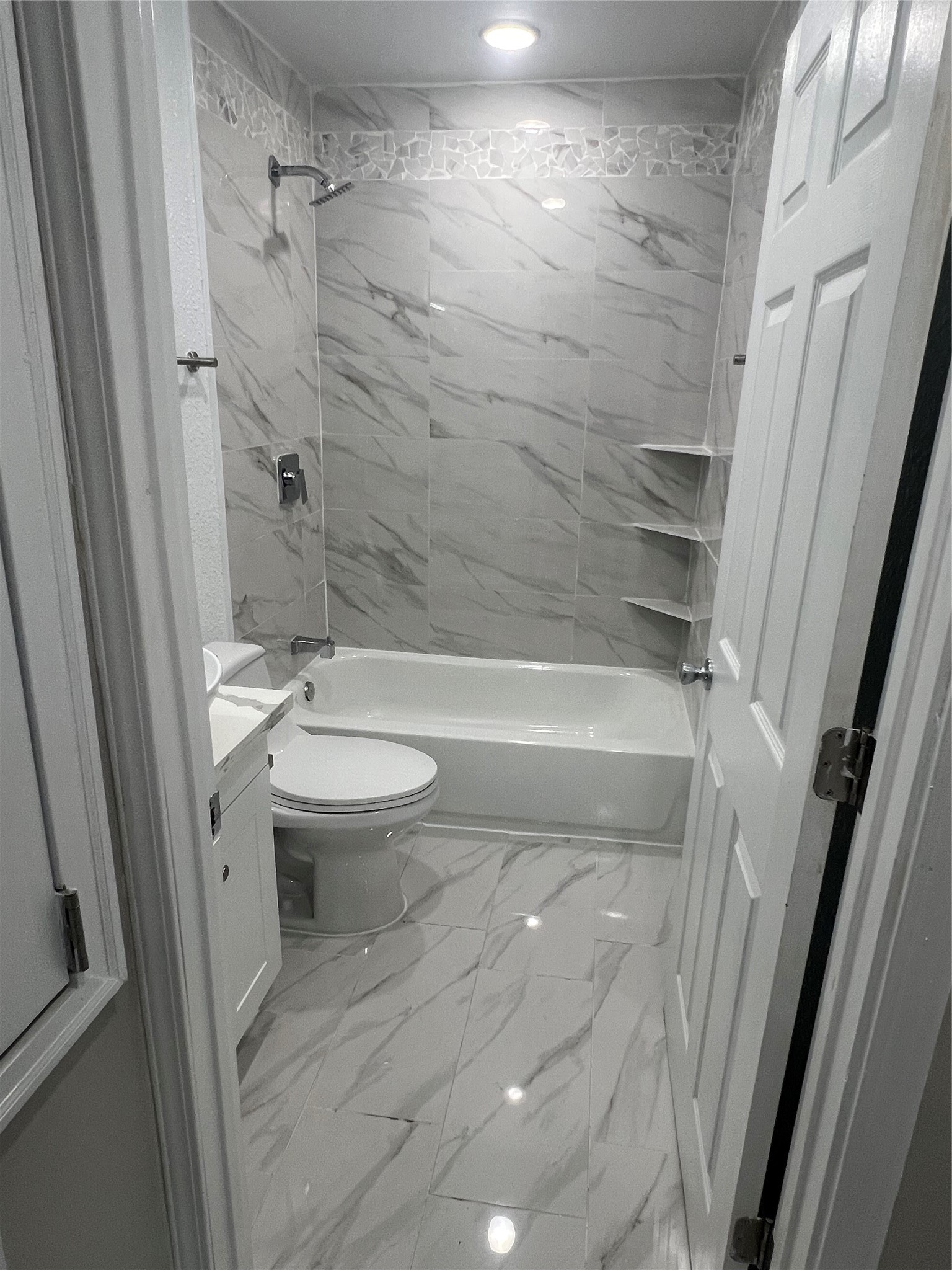 22418 East Shorewood Loop Houston, TX 77336 - Photo 10 of 20 a bathroom with a toilet and a shower