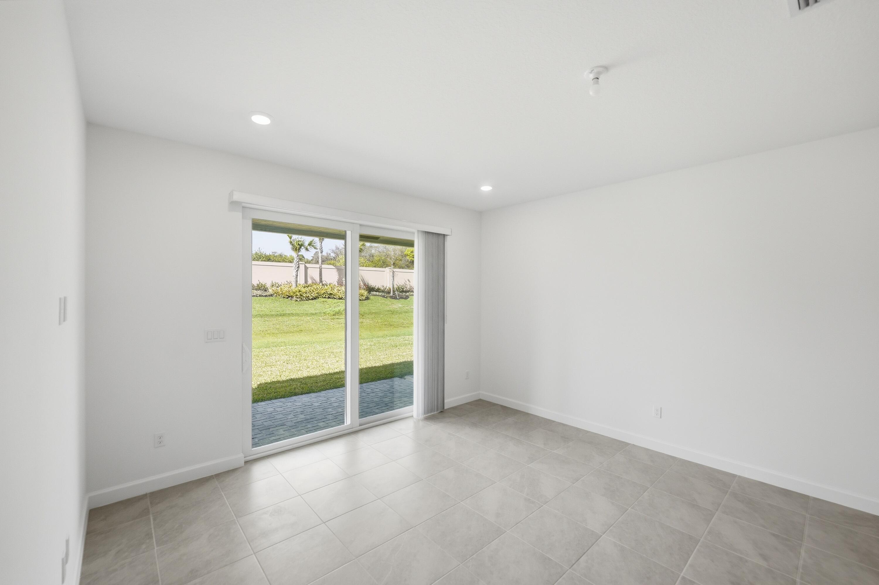 3736 Harborside Avenue Fort Pierce, FL 34946 - Photo 13 of 16 a view of an empty room with a sliding door