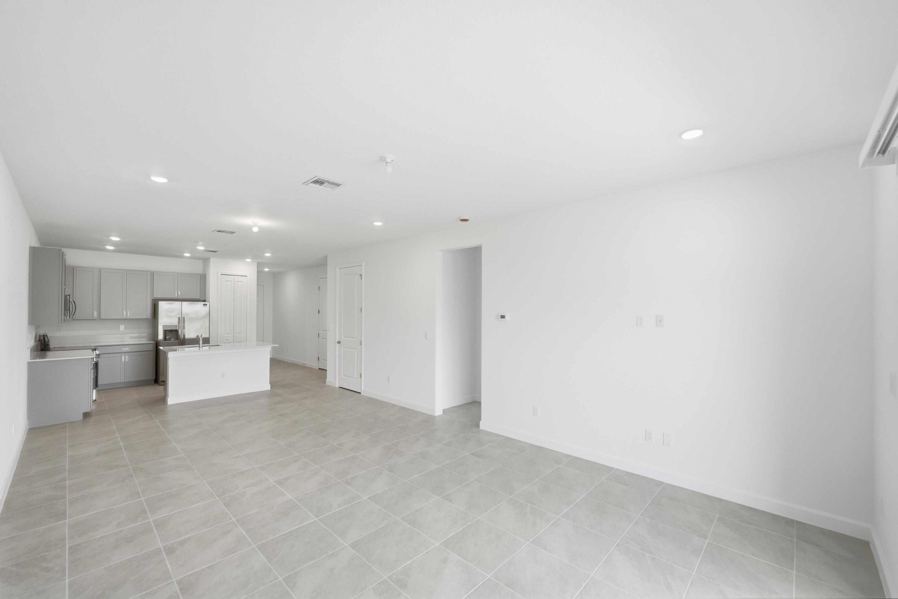 3736 Harborside Avenue Fort Pierce, FL 34946 - Photo 7 of 16 a view of a living room and kitchen