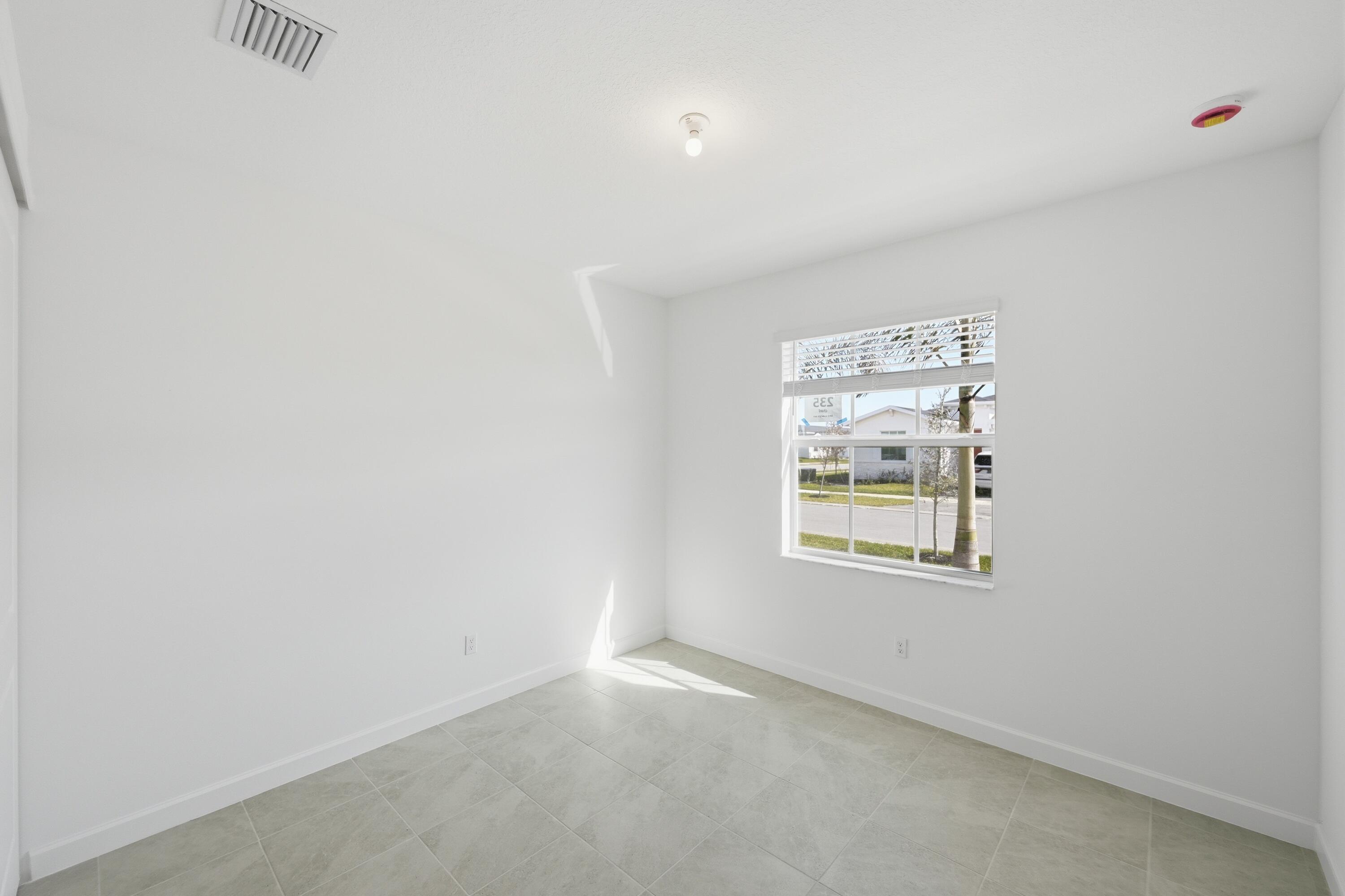 3736 Harborside Avenue Fort Pierce, FL 34946 - Photo 10 of 16 an empty room with a window
