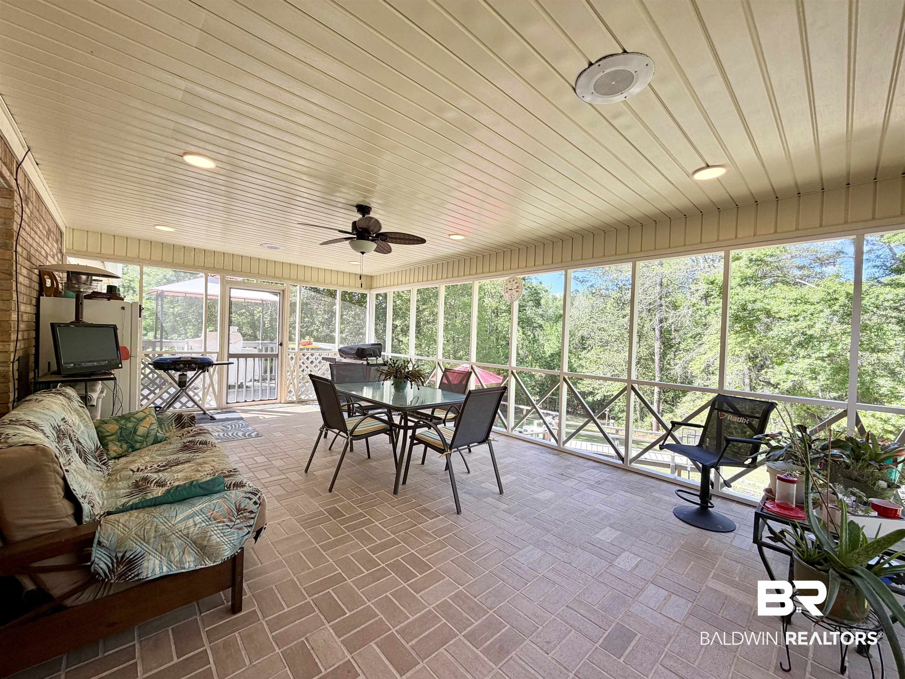 2944 Appleton Road Brewton, AL 36426 - Photo 34 of 65 Sunroom / solarium with ceiling fan and outdoor dining space