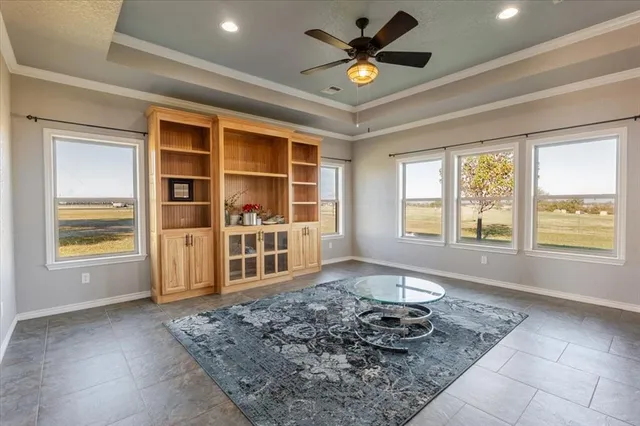 a living room with a couch next to a window