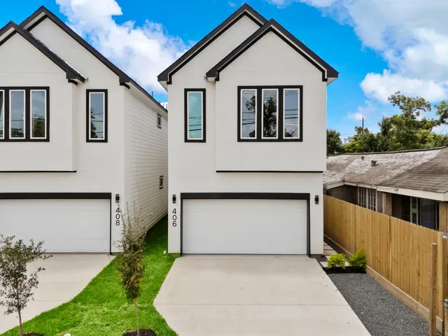 a front view of a house with garage