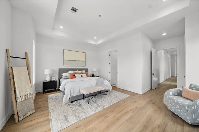 a bed room with a bed and a couch