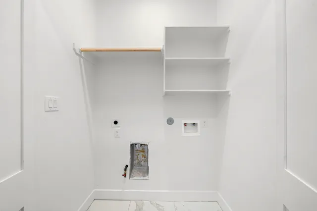 a view of a house with a yard and a large tree