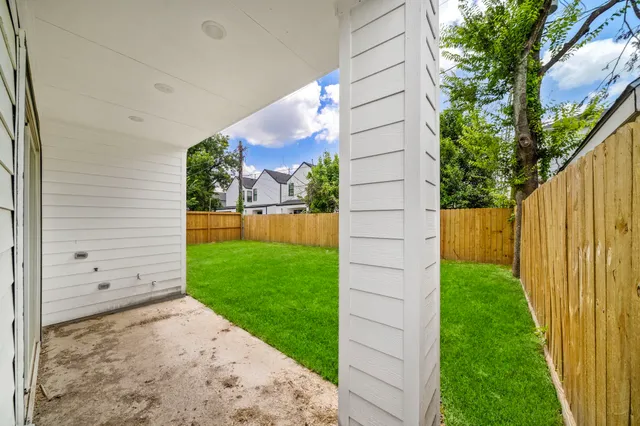 an aerial view of a houses with a yard