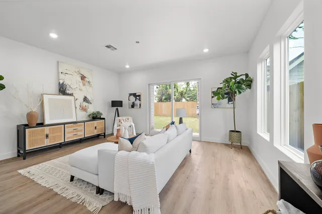 a living room with furniture and a bed