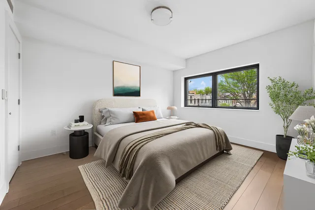 a living room with kitchen island furniture and a chandelier