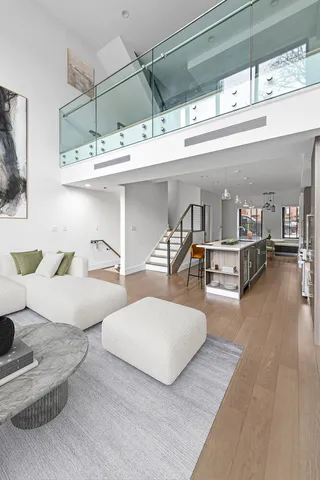 a view of a patio with couches chairs and potted plants