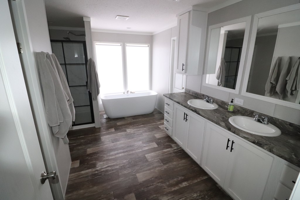 20120 Other Rocksprings, TX 78880 - Photo 17 of 22 a bathroom with a granite countertop sink and a large mirror