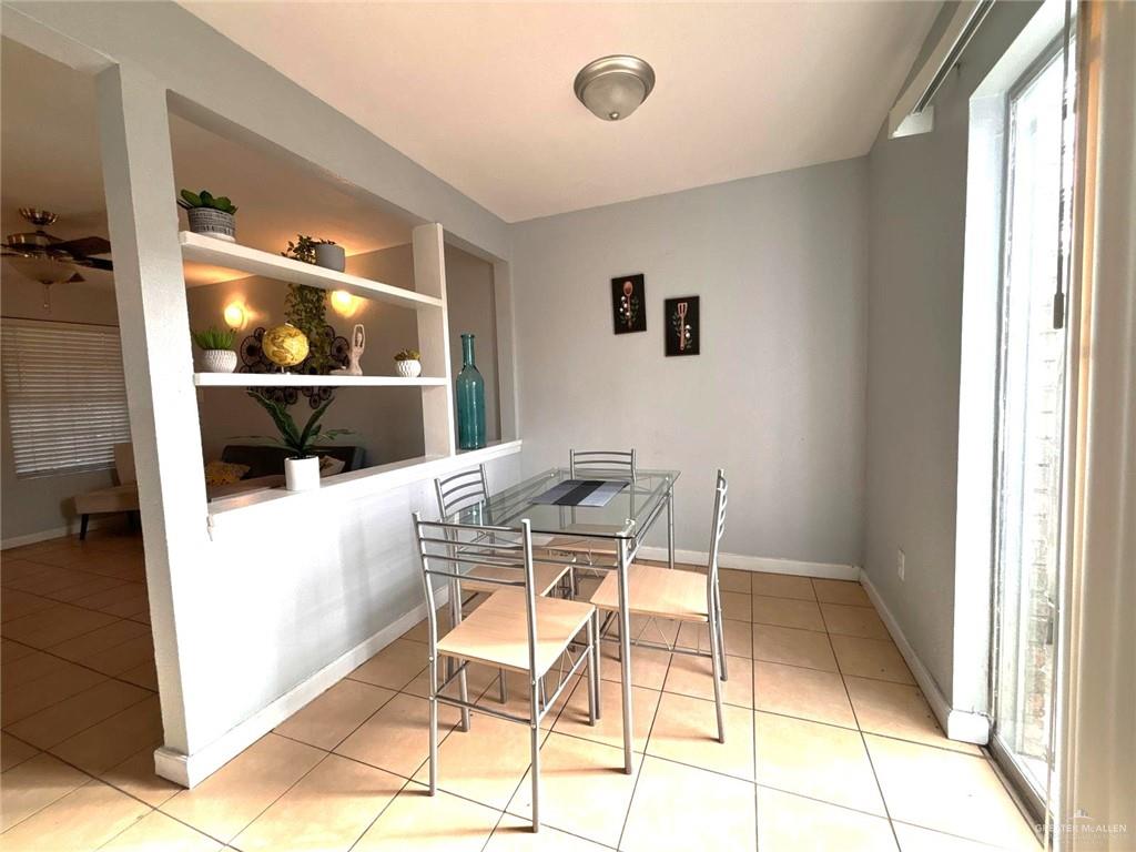 2428 Upas Avenue, Unit 3 McAllen, TX 78501 - Photo 5 of 14 a view of a dining room with a table and chairs