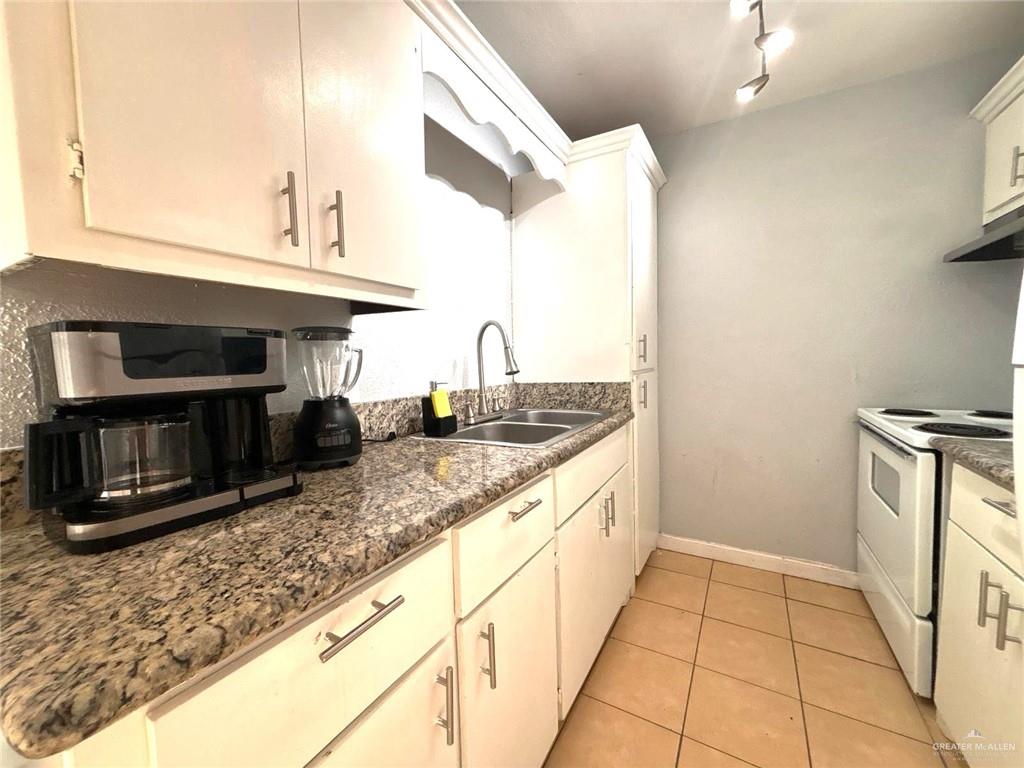 2428 Upas Avenue, Unit 3 McAllen, TX 78501 - Photo 9 of 14 a kitchen with stainless steel appliances granite countertop a sink and a stove