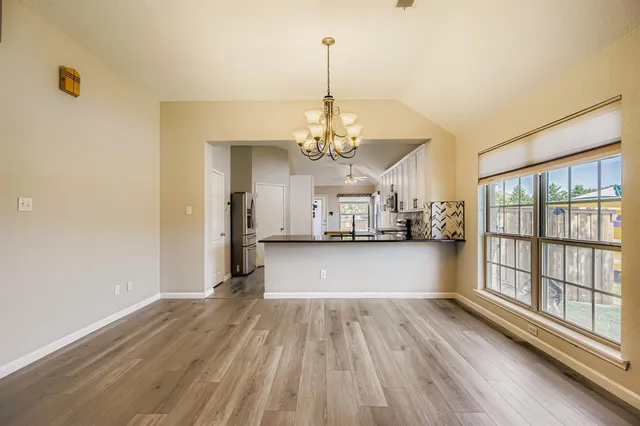 a kitchen with a sink stove and refrigerator