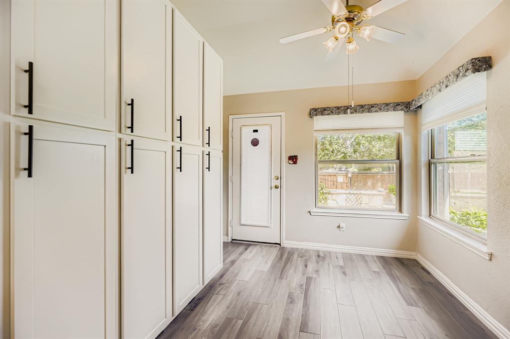 5452 Buckskin Drive The Colony, TX 75056 - Photo 19 of 31 Newer Builtins -Kitchen- featuring light flooring and a ceiling fan