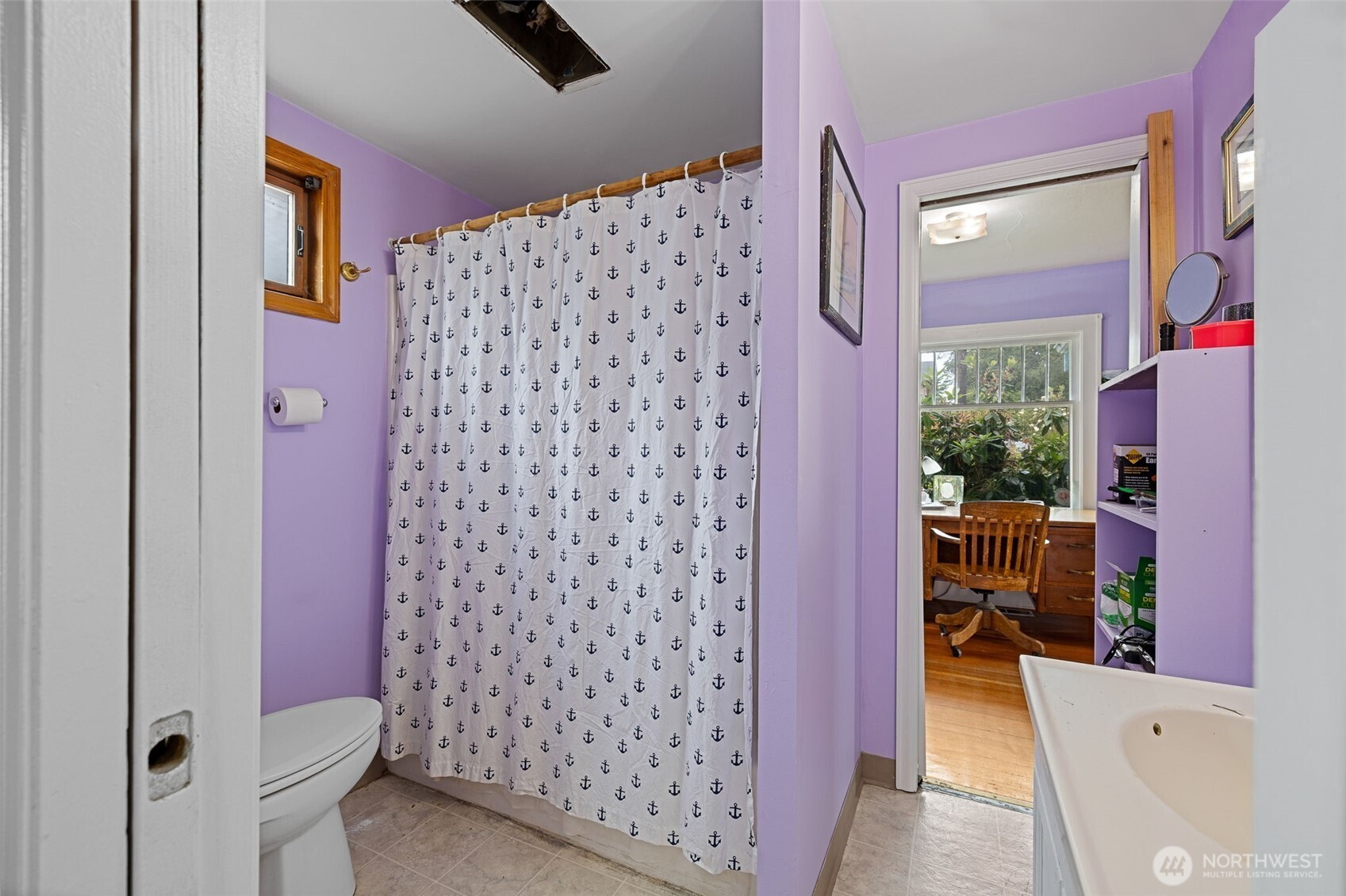 2310 Lowell Road Everett, WA 98203 - Photo 16 of 34 a bathroom with a shower curtain