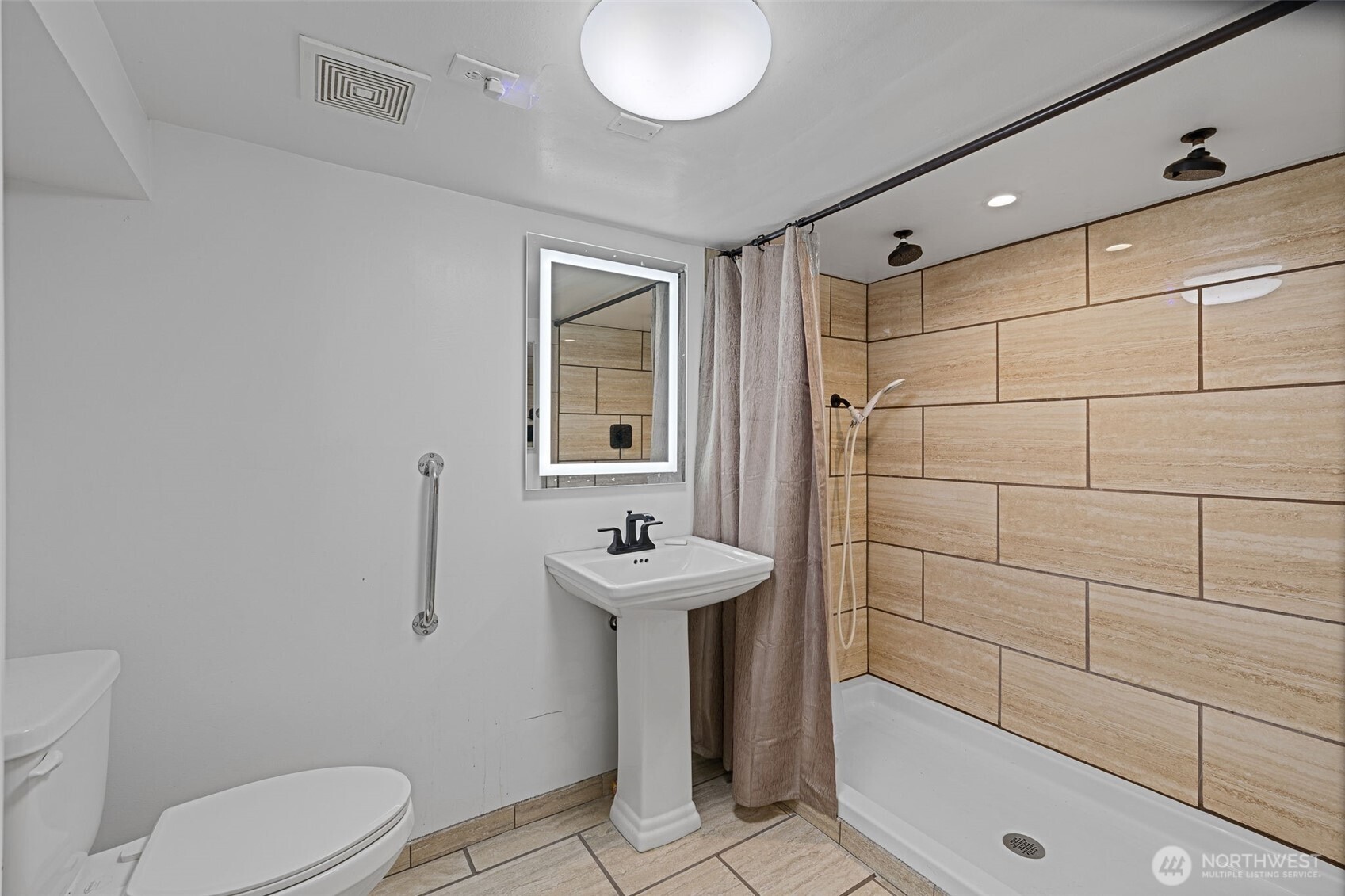 2310 Lowell Road Everett, WA 98203 - Photo 21 of 34 a bathroom with a sink toilet and shower