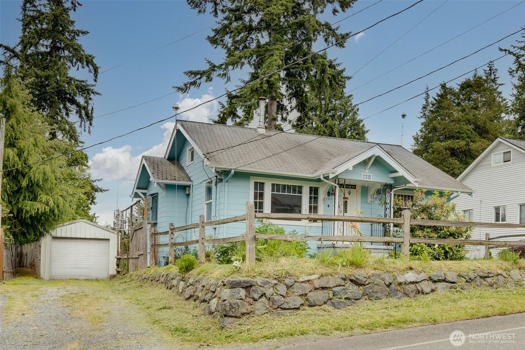2310 Lowell Road Everett, WA 98203 - Photo 3 of 34 a front view of a house with a yard