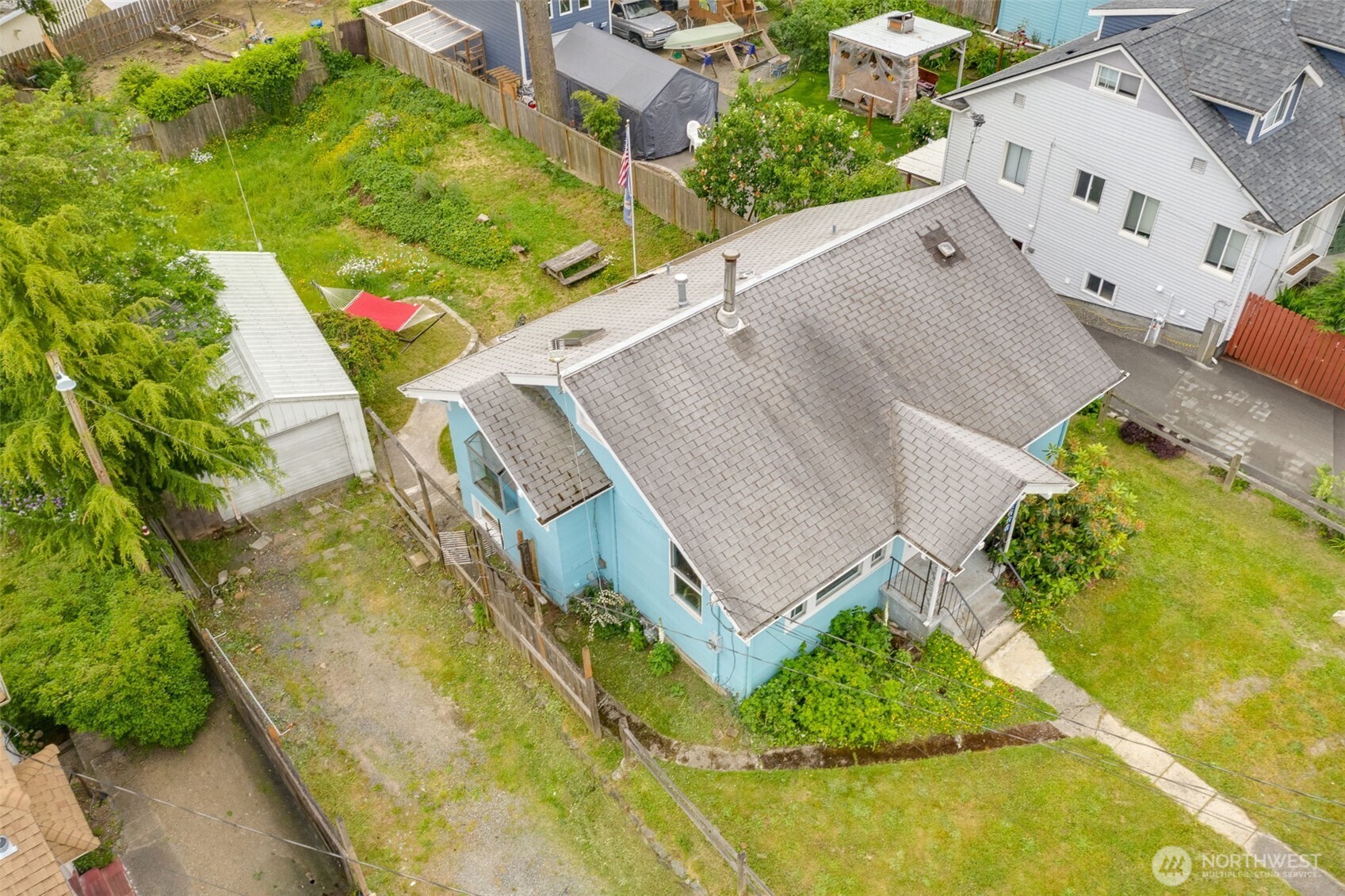 2310 Lowell Road Everett, WA 98203 - Photo 5 of 34 an aerial view of a house with a yard and trees