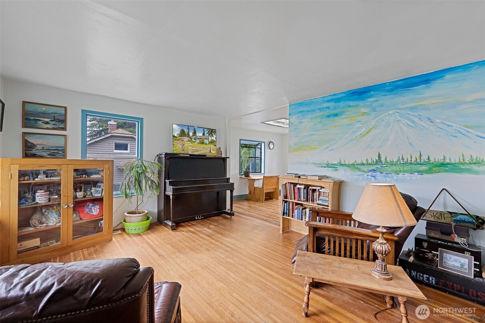 2310 Lowell Road Everett, WA 98203 - Photo 7 of 34 a living room with furniture a fireplace and a flat screen tv