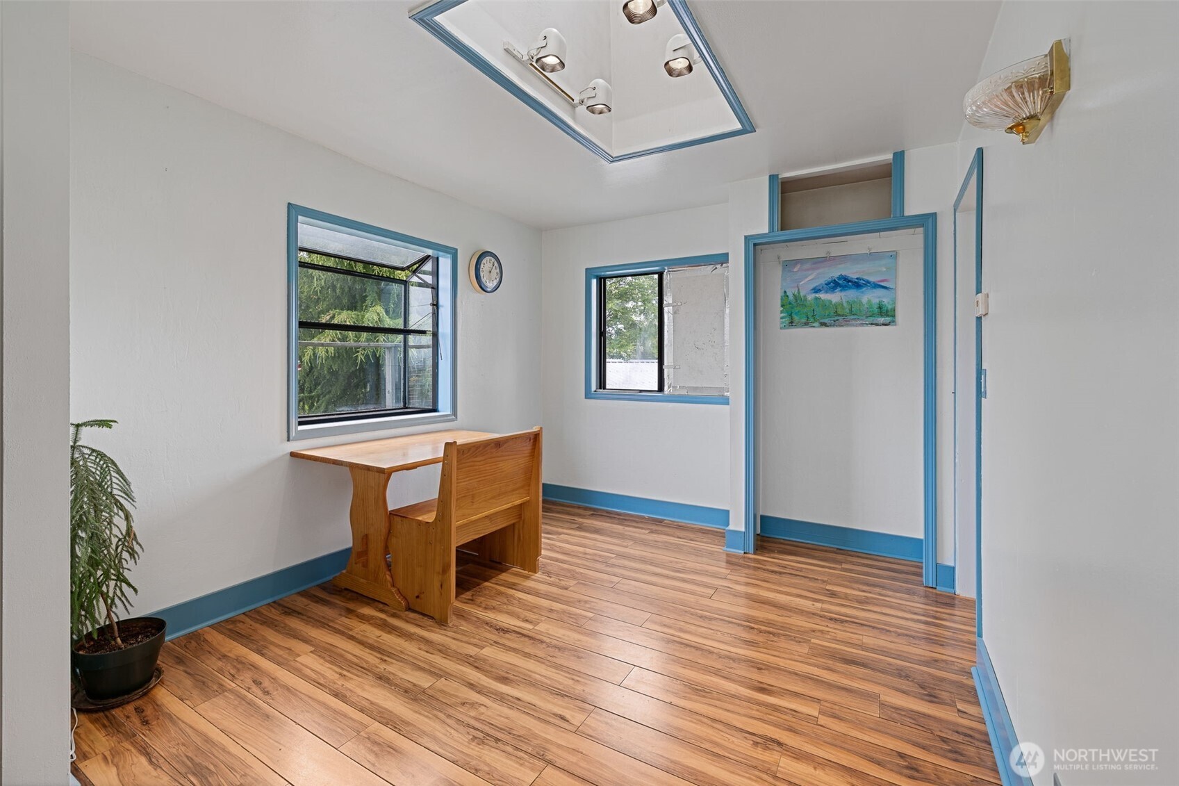 2310 Lowell Road Everett, WA 98203 - Photo 9 of 34 a view of a livingroom with wooden floor and a ceiling fan