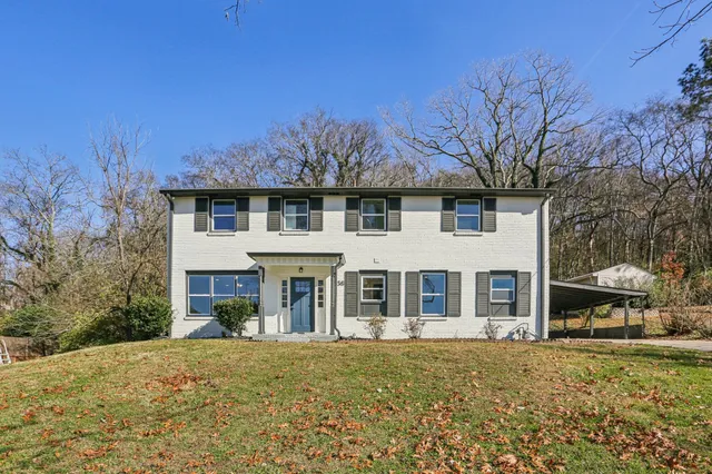 front view of a house with a yard