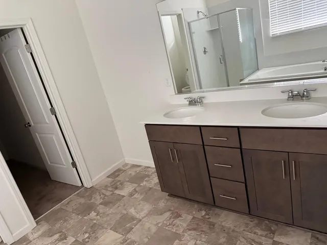 a bathroom with a sink a mirror and vanity