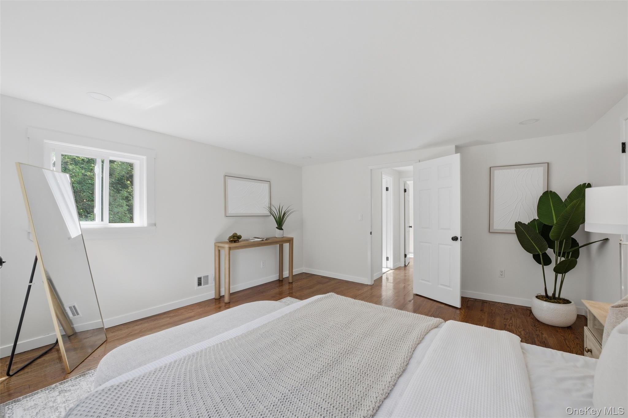 24 Fuller Road Ossining, NY 10562 - Photo 27 of 48 a bedroom with a bed potted plant and a window