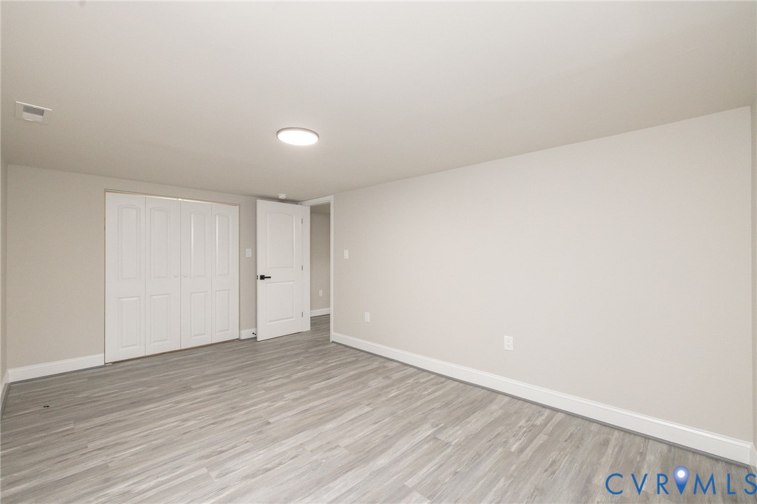1103 Burnside Street Hopewell, VA 23860 - Photo 11 of 44 a view of an empty room with wooden floor