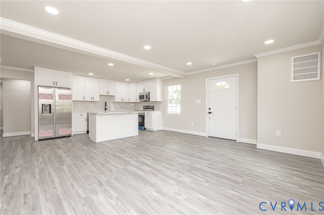 1103 Burnside Street Hopewell, VA 23860 - Photo 12 of 44 a view of a kitchen with a sink and dishwasher a refrigerator with wooden floor