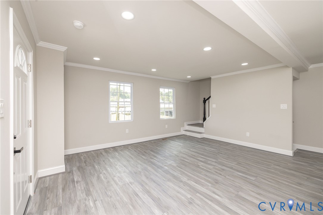 1103 Burnside Street Hopewell, VA 23860 - Photo 13 of 44 an empty room with wooden floor and windows