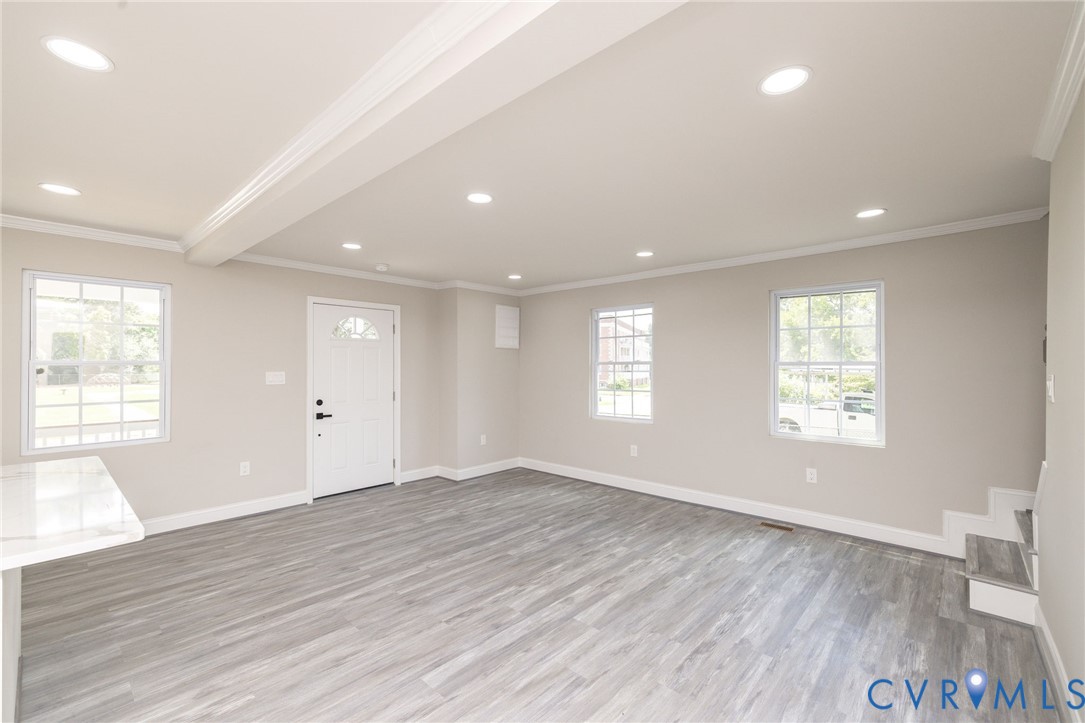 1103 Burnside Street Hopewell, VA 23860 - Photo 14 of 44 a view of an empty room with wooden floor and a window