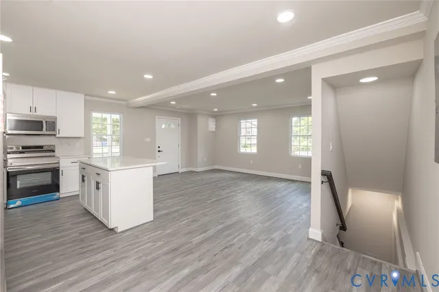 a view of a hallway with wooden floor and breakfast area