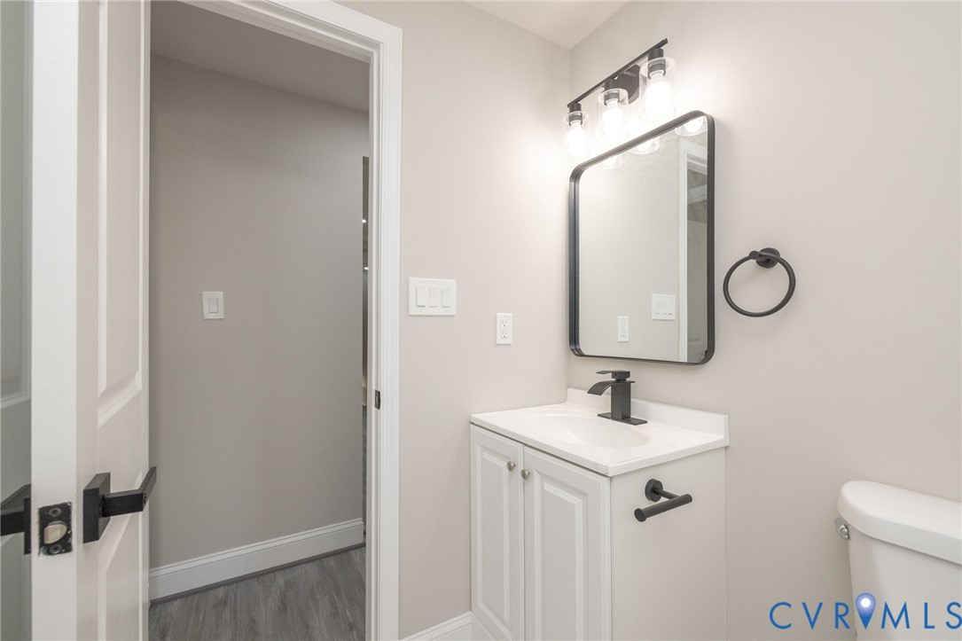 1103 Burnside Street Hopewell, VA 23860 - Photo 24 of 44 a bathroom with a sink vanity and a mirror