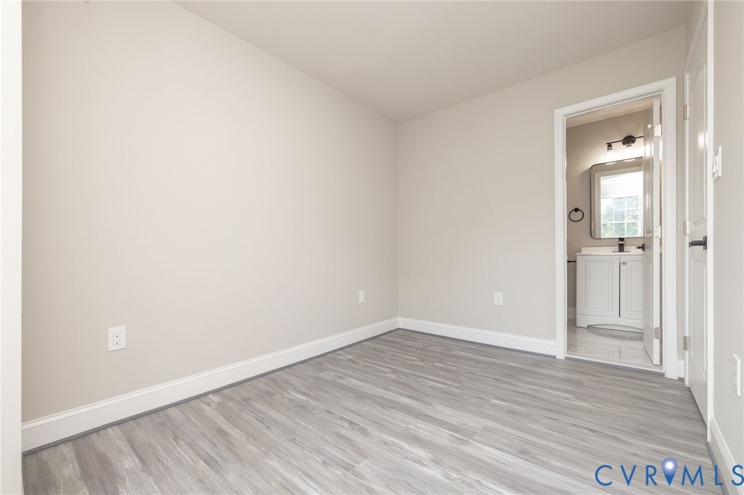 1103 Burnside Street Hopewell, VA 23860 - Photo 32 of 44 a view of an empty room with wooden floor